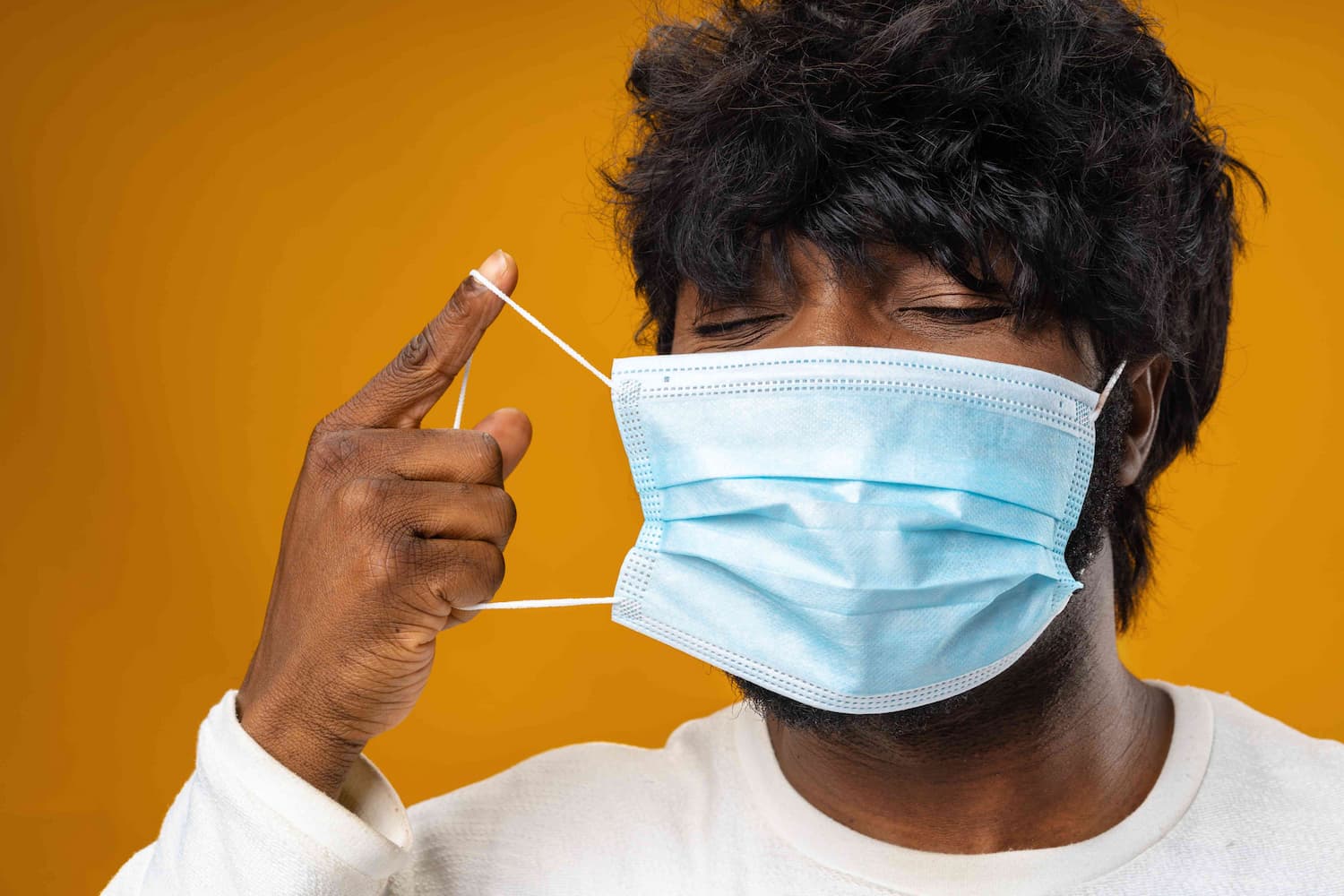 man taking of facemask 1